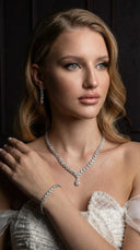 Close-up of Monaco wedding jewelry set featuring teardrop cubic zirconia stones in a silver-tone rhodium plated finish.