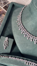 Side view of bridal necklace and earrings set with elegant crystal design