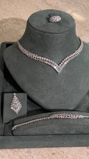 Close-up bridal zircon necklace set showing high shine rhodium plated wedding jewelry