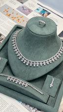 CZ bridal necklace with teardrop stones and matching pavé ring in rhodium plating