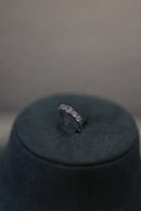 Close-up of bridal ring with a row of round zircon stones in a minimal band design