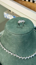 Full view of luxury bridal jewelry set with necklace earrings bracelet and ring for modern bride