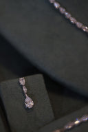Bridal drop earrings with teardrop zircon design displayed in detailed close-up
