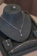 Close-up of bridal teardrop necklace with delicate zircon stones and single drop pendant