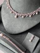 Close-up of bridal necklace highlighting pearl drops and detailed zircon setting