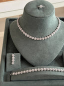 Close-up of bridal bracelet with round cluster zircon stones in continuous pattern