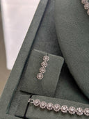 Bridal drop earrings with round cluster zircon stones in a vertical design