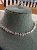 Side angle of bridal cluster necklace showing layered sparkle and stone arrangement