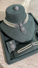 Luxury Aviola pearl wedding jewelry set with layered choker and statement crystal design