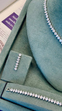 Bridal drop earrings with marquise and round zircon stones in vertical design