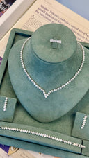 Luxury bridal jewelry set arranged in box with necklace earrings bracelet and ring