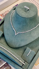 Close-up of V shape bridal necklace with alternating marquise and round zircon stones