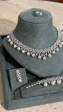 Aviola luxury bridal pearl jewelry set with floral crystal details and soft pearls