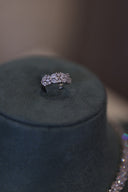 Adjustable bridal ring with floral zircon design displayed in close-up