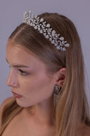 Front view of a bride wearing a luxury silver zircon bridal tiara with a delicate vine-inspired wedding crown design