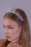 Bride wearing a silver-plated AAAA zircon botanical vine tiara for an elegant wedding look