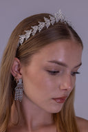 Silver leaf bridal tiara worn by a bride, featuring clear zircon branches and a graceful central peak for an elegant wedding look.