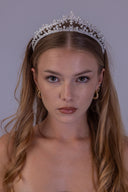 Front view of a rhodium-plated bridal tiara with AAAA zircon leaf detailing, elevated arches and elegant white pearl accents.