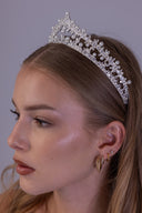 Close side view of the silver wedding tiara showing marquise zircon leaves, suspended pearls and its graceful graduated height.