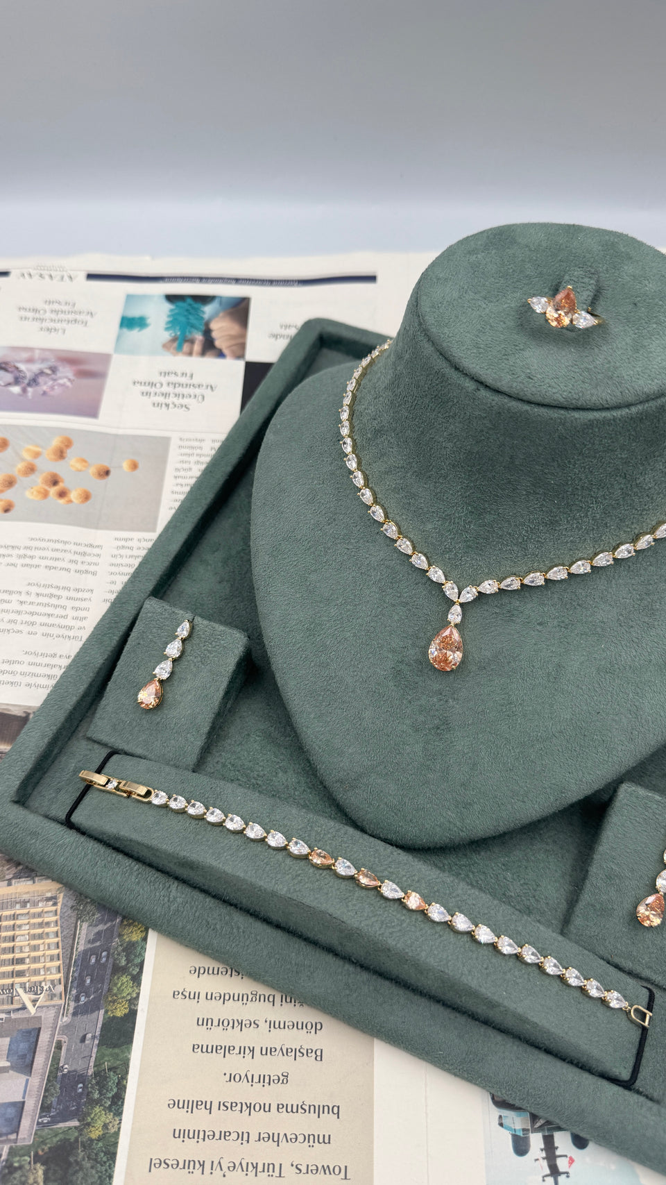 Complete gold plated bridal jewelry set with champagne teardrop tennis necklace earrings bracelet and adjustable ring