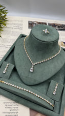 Complete gold-plated bridal wedding jewelry set with pear-cut necklace, earrings, bracelet and adjustable ring
