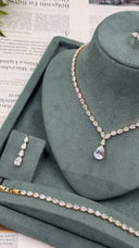 Gold-plated teardrop bridal necklace with clear pear-cut zircon stones, matching earring and bracelet