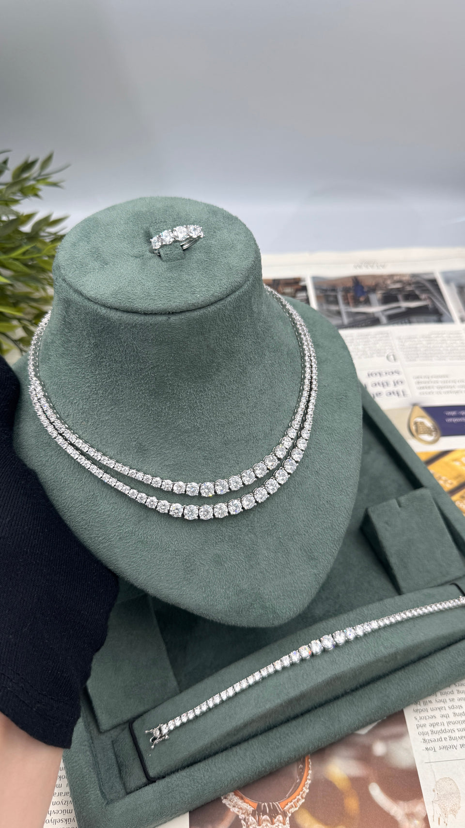 Double-row graduated round-cut bridal necklace displayed with a matching tennis bracelet and adjustable zircon ring