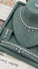 Close-up of a marquise leaf fringe bridal necklace with suspended pear-cut drops and matching adjustable zircon ring