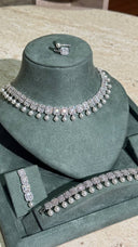 Elegant bridal pearl choker jewelry set with zircon stones and matching bracelet
