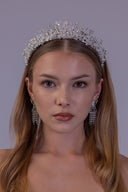 bride wearing a celestial silver bridal crown with zircon stars, white pearls and an elevated constellation-inspired centerpiece.