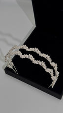 Close-up of marquise-style crystals on leaf vine bridal headband in silver