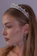 Side view of the double-arch wedding tiara showing pear-cut zircon finials, open lattice details and its graduated centre height.