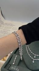Double row marquise zircon tennis bracelet worn on the wrist for an elegant bridal look