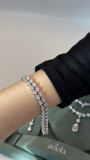 Double row pear cut zircon tennis bracelet worn on the wrist for an elegant bridal look