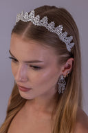 Luxury wedding crown for a bride shown from the side, with sparkling marquise zircon leaves in a silver-tone setting