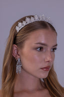 Bride wearing a silver-plated AAAA zircon leaf crest tiara in a polished front view
