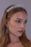 Floral branch wedding tiara shown at an angle, with sparkling zircon flowers and graduated silver leaves for the bride.