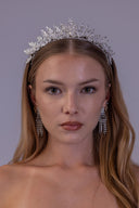 Silver zircon floral wedding tiara shown from the side, with sparkling leaf clusters and an elevated center for the bride