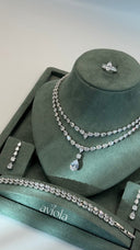 Complete wedding jewelry set with layered pear cut necklace earrings double row bracelet and ring