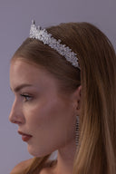 Side profile of an elegant botanical bridal tiara featuring densely arranged clear AAAA zircon stones