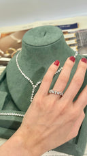 Hand wearing a zircon ring