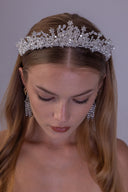 Side profile of a celestial pearl bridal crown with zircon star accents and airy silver branches designed for a romantic wedding look.