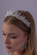 Close-up of a botanical bridal tiara featuring marquise zircon leaves, floral clusters and a detailed silver-tone setting