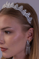 Silver botanical wedding tiara worn by a bride, showing its graduated leaf pattern and elegant crown silhouette