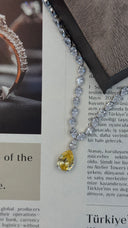 Bridal yellow teardrop necklace pendant close up sparkle wedding jewelry