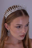 bride wearing a royal silver zircon bridal crown with tall symmetrical spires and a refined luxury wedding silhouette.