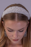 Luxury beaded bridal tiara shown from above, highlighting white pearl accents and the crown’s softly graduated silhouette