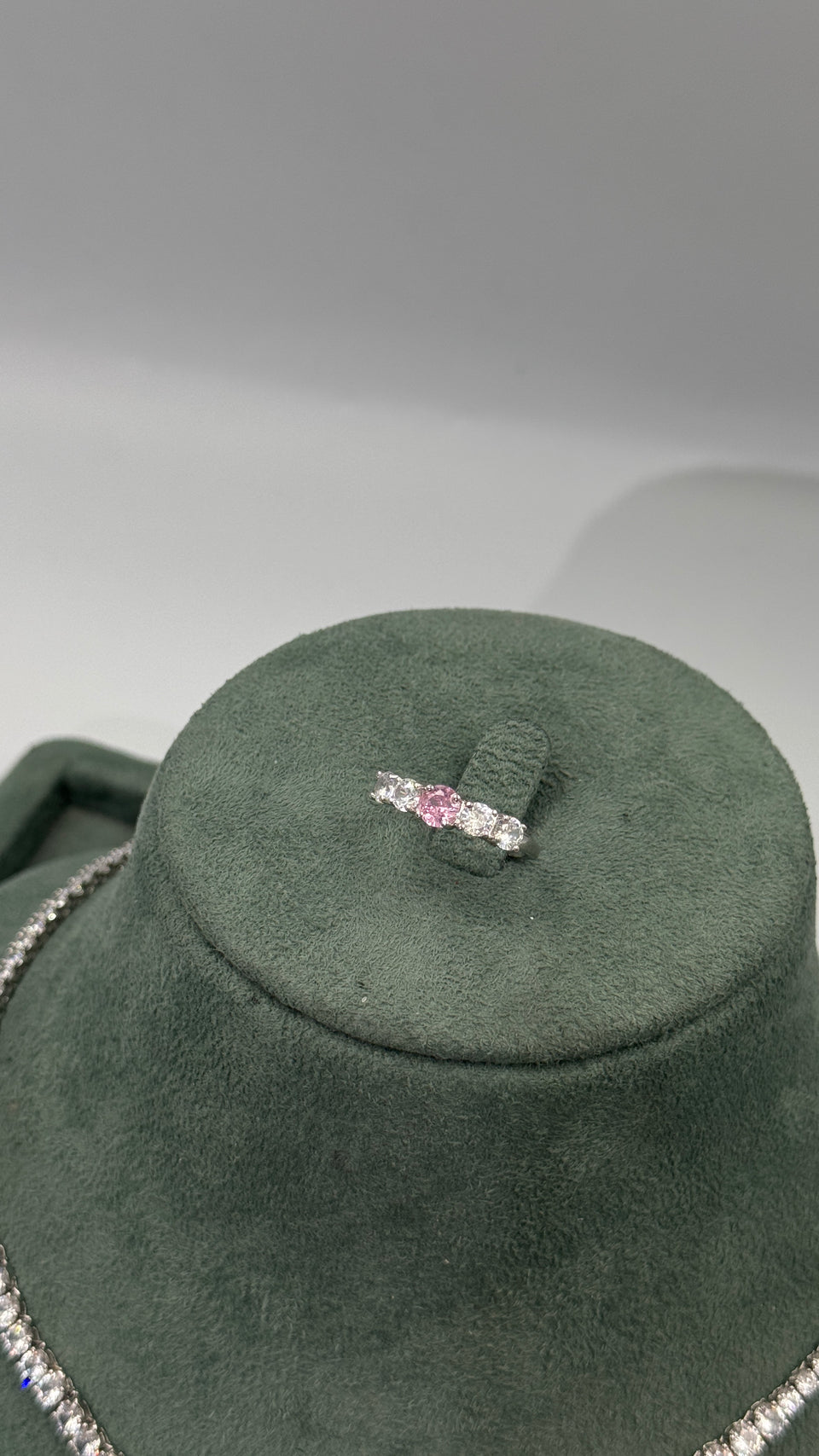Adjustable five stone bridal ring with a pink round zircon center and four clear side stones