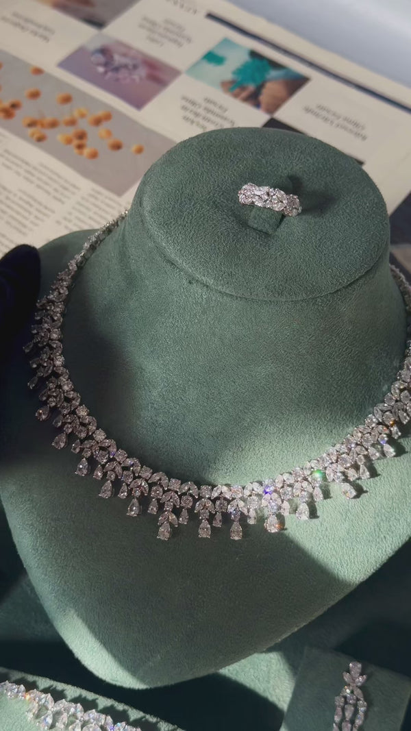 Luxury bridal wedding jewelry set with teardrop zirconia necklace earrings bracelet and ring sparkling in motion