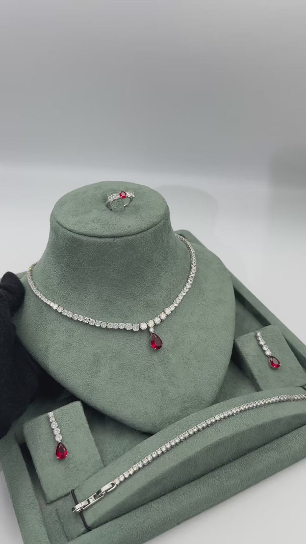 Ravena ruby red teardrop bridal jewelry set video showing the tennis necklace matching earrings bracelet and adjustable ring
